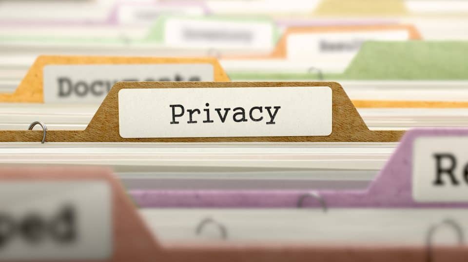 File Folder Labeled as Privacy in Multicolor Archive. Closeup View. Blurred Image.
